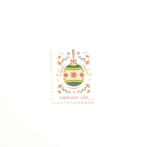 This is a green stamps by Flourish Fine Writing called forever holiday joy ornament postage stamps // green ornament and pink flowers // unused in standard