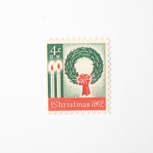 This is a green stamps by Flourish Fine Writing called 4 cent christmas wreath & candles // set of 10 // unused vintage stamps in standard