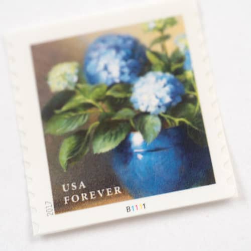 This is a blue stamps by Flourish Fine Writing called blue hydrangea in blue vase forever stamp // set of 10 in standard