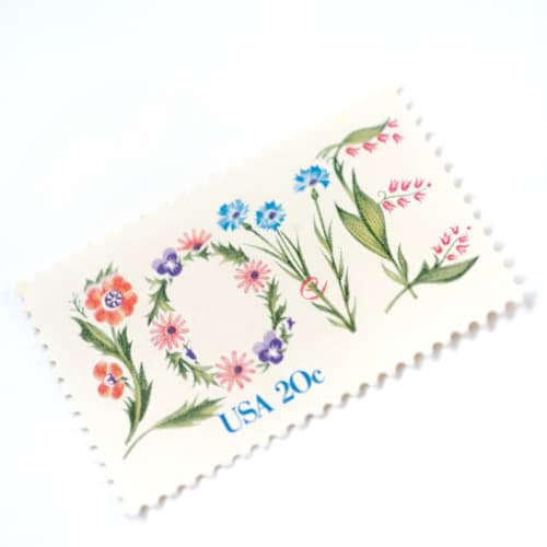 This is a pink stamps by Flourish Fine Writing called 20 cent floral love postage stamps // set of 10 // unused vintage stamps in standard