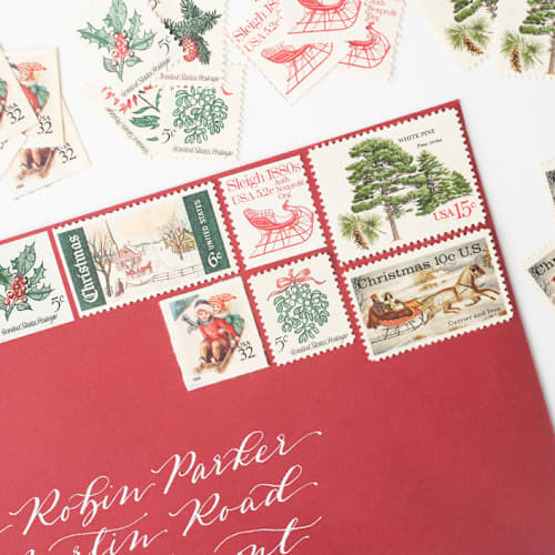 This is a green stamps by Flourish Fine Writing called winter wonderland vintage postage set // set of 5 // unused // sleigh ride in standard