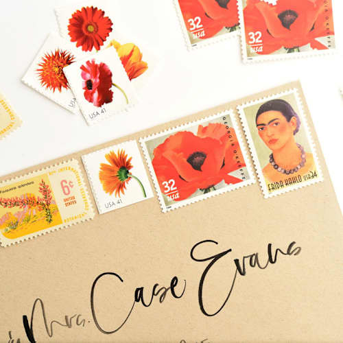 This is a orange stamps by Flourish Fine Writing called frida kahlo and georgia o'keeffe postage set // set of 5 // $1.13 in postage per set in standard