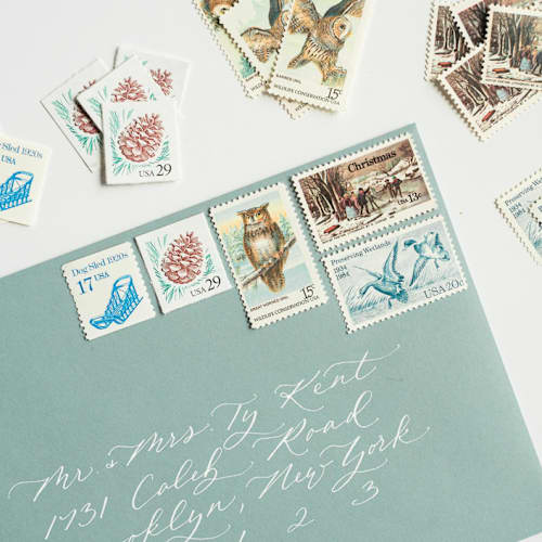 This is a blue stamps by Flourish Fine Writing called shades of blue vintage holiday postage set- nature themed // set of 5 in standard