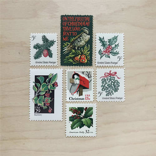 This is a green stamps by Kristen Melchor called 87 cent . christmas foliage vintage postage stamps . set of 5 in standard
