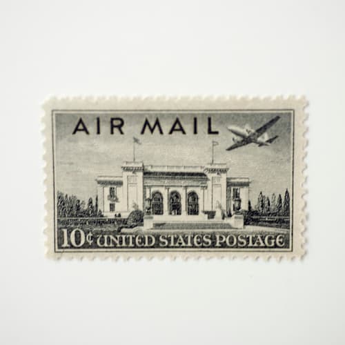 This is a black stamps by Flourish Fine Writing called 10 cent pan am building airmail postage stamps // set of 10 // unused postage stamps in standard