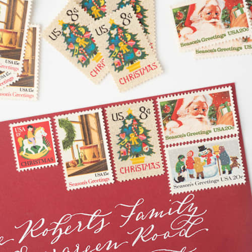 This is a red stamps by Flourish Fine Writing called snow days holiday postage set // set of 5 // unused // santa // needlepoint in standard