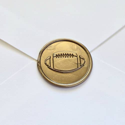This is a multicolor wax seals by Inkspiringletters called football- customizable color- hand-crafted wax seals- set of 25 in standard