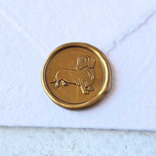 This is a multicolor wax seals by Inkspiringletters called doxie- customizable color- set of 25 hand-crafted wax seals in standard