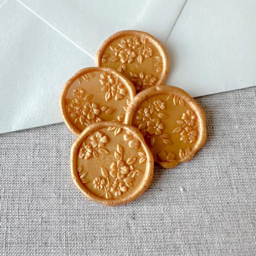 This is a gold wax seals by Orchid Studio called yellow gold floral pattern 3d wax seal stickers | set of 10 in standard