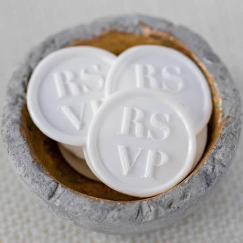 This is a white wax seals by Lindsey Cain called rsvp (sold in sets of 10) in standard