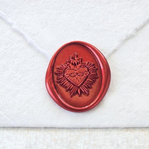 This is a multicolor wax seals by Inkspiringletters called sacred heart- customizable color- set of 25 hand-crafted wax seals in standard