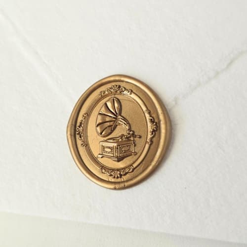 This is a multicolor wax seals by Inkspiringletters called phonograph - customizable color- set of 25 hand-crafted wax seals in standard