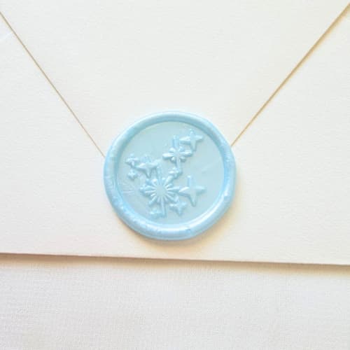 This is a multicolor wax seals by Inkspiringletters called stardust- customizable color- set of 25 hand-crafted wax seals in standard