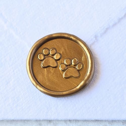 This is a multicolor wax seals by Inkspiringletters called paws- customizable color- set of 25 hand-crafted wax seals in standard