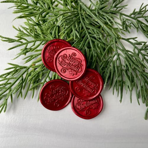 This is a red wax seals by Honey Silks Co called merry christmas red wax seal - set of 10 in standard