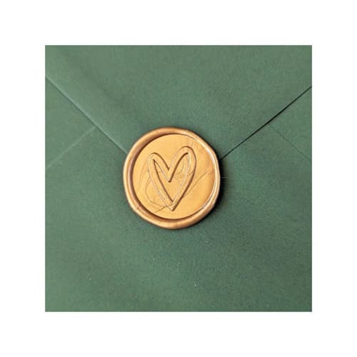 This is a multicolor wax seals by Inkspiringletters called handwritten heart- customizable color- set of 25 hand-crafted wax seals in standard