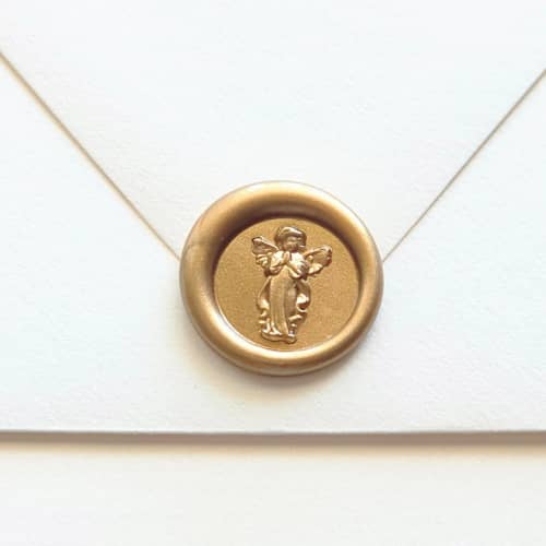 This is a multicolor wax seals by Inkspiringletters called mini angel- customizable color- mini hand-crafted wax seals- set of 25 in standard