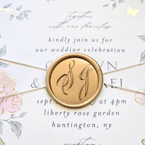 This is a multicolor wax seals by Inkspiringletters called customizable double initial script monogram- hand-crafted wax seals - set of 25 in standard