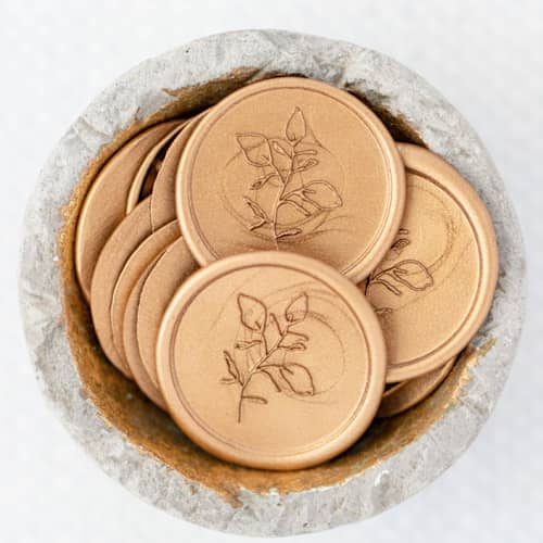 This is a gold wax seals by Lindsey Cain called martha's vineyard (sold in sets of 10) in standard