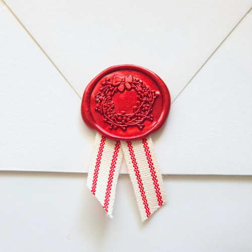 This is a multicolor wax seals by Inkspiringletters called festive wax seal with striped ribbon- customizable- set of 10 in standard