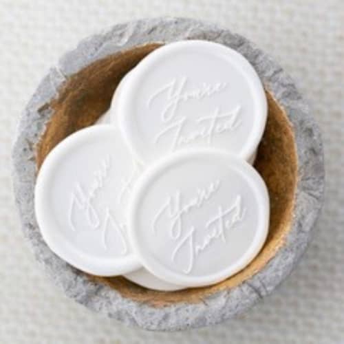 This is a white wax seals by Lindsey Cain called you're invited (sold in sets of 10) in standard