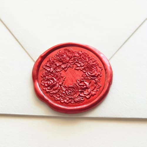 This is a multicolor wax seals by Inkspiringletters called rose wreath- customizable color- hand-crafted wax seals- set of 25 in standard