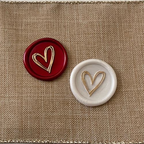 This is a multicolorassorted-colors wax seals by Vee called custom heart wax seals with gold or silver accent (set of 10) in standard