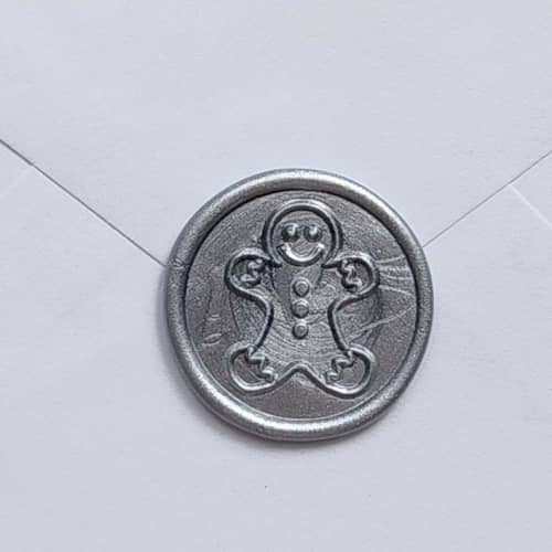 This is a multicolorassorted-colors wax seals by MC silverlinings called customizable color gingerbread man wax seals, self-adhesive seals, set of 5 in standard