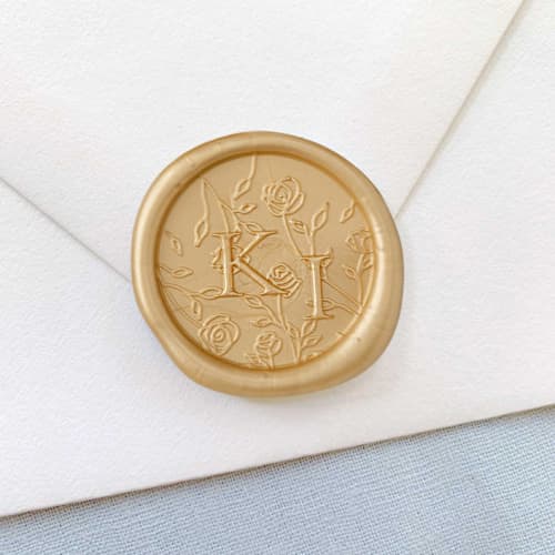 This is a gold wax seals by Sterling Stripes called katherine wax seal (50 pack) personalized in standard