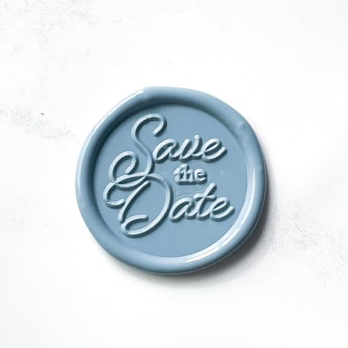This is a blue wax seals by Abby Choi called save the date in dusty blue pack of 10 in standard