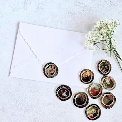 This is a multicolorassorted-colors wax seals by Inkspiringletters called fine art gilded framed roses- set of 9 hand-crafted wax seals in standard