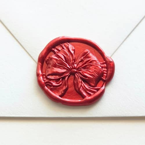 This is a multicolor wax seals by Inkspiringletters called silk bow- customizable color- hand-crafted wax seals- set of 25 in standard