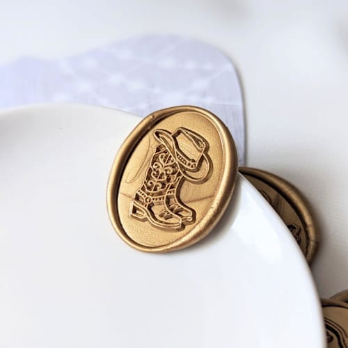 This is a multicolor wax seals by Inkspiringletters called cowboy boots- customizable color- set of 25 hand-crafted wax seals in standard