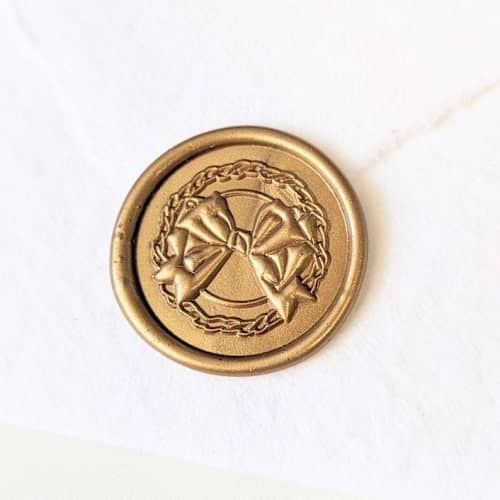 This is a gold wax seals by Inkspiringletters called wreath - customizable color- set of 25 hand-crafted wax seals in standard