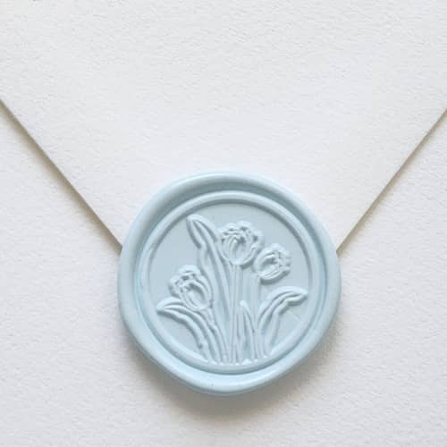 This is a multicolorassorted-colors wax seals by MC silverlinings called customizable color tulips self-adhesive wax seals, set of 5 in standard