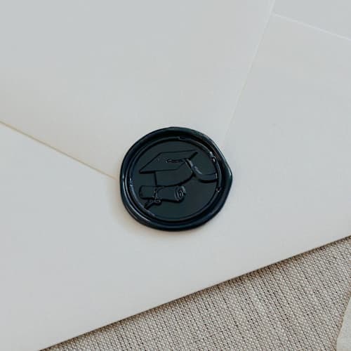 This is a blue wax seals by Orchid Studio called navy graduation wax seal stickers - set of 10 in standard