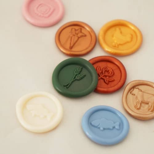 This is a multicolorassorted-colors wax seals by misterrobinson called mini meal choice wax seal stickers, pack of 10 in standard