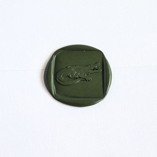 This is a multicolor wax seals by Inkspiringletters called gator- customizable color- set of 25 hand- crafted wax seals in standard