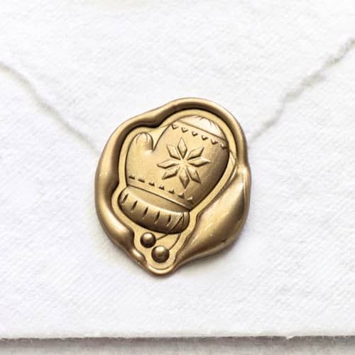 This is a multicolor wax seals by Inkspiringletters called mitten- customizable color - set of 25 hand-crafted wax seals in standard