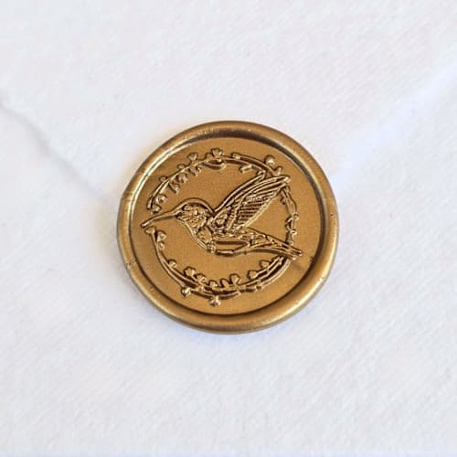 This is a multicolor wax seals by Inkspiringletters called hummingbird- customizable color- set of 25 hand-crafted wax seals in standard