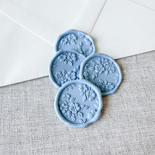 This is a blue wax seals by Orchid Studio called dusty blue floral pattern 3d wax seal stickers | set of 10 in standard