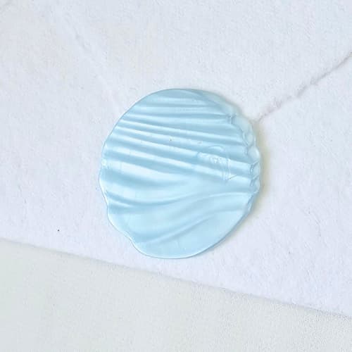 This is a multicolor wax seals by Inkspiringletters called ocean breeze- customizable color- set of 25 hand-crafted wax seals in standard