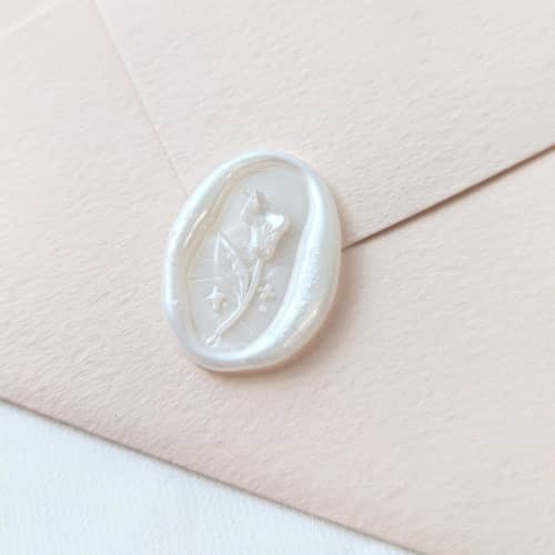 This is a multicolor wax seals by Inkspiringletters called calla lily- customizable color- set of 25 hand-crafted wax seals in standard