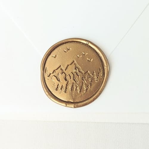 This is a multicolor wax seals by Inkspiringletters called mountain scene- customizable color- set of 25 hand-crafted wax seals in standard