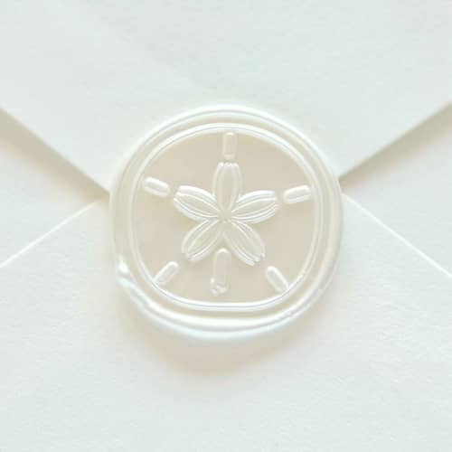 This is a multicolor wax seals by Inkspiringletters called sand dollar shell- hand-crafted wax seals- customizable color- set of 25 in standard