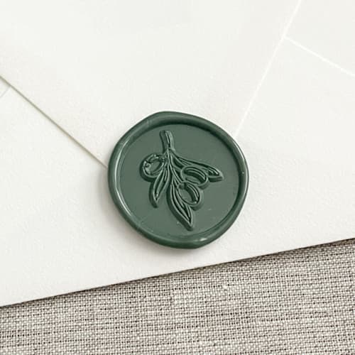 This is a green wax seals by Orchid Studio called olive branch self-adhesive wax seal in olive green | set of 10 in standard