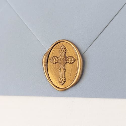 This is a multicolor wax seals by Inkspiringletters called cross- customizable color- set of 25 hand-crafted wax seals in standard