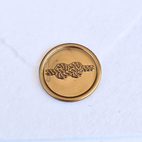 This is a multicolor wax seals by Inkspiringletters called infinity knot- customizable color- set of 25 hand-crafted wax seals in standard