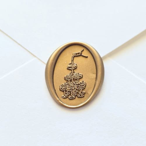 This is a multicolor wax seals by Inkspiringletters called champagne tower- customizable color- hand-crafted wax seals- set of 25 in standard