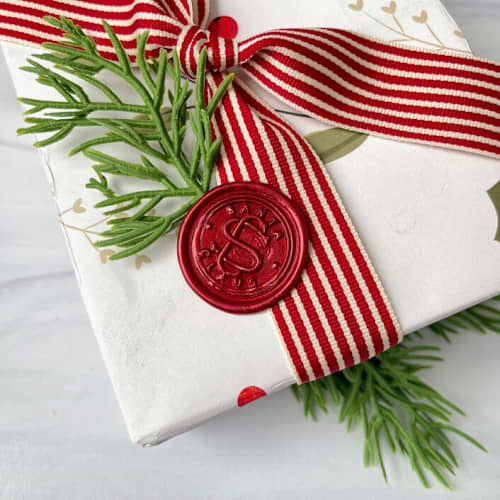 This is a red wax seals by Honey Silks Co called santa claus red wax seal - set of 10 in standard